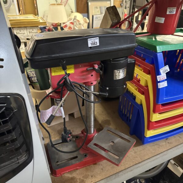 Clarke pillar drill in a workshop setting, metalworking tool.