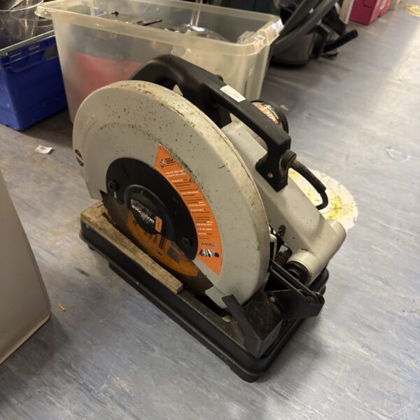 Used Evolution chop saw for metal cutting in workshop setting.