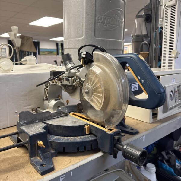 Used Titan 8” chop saw for metal cutting in a workshop setting.
