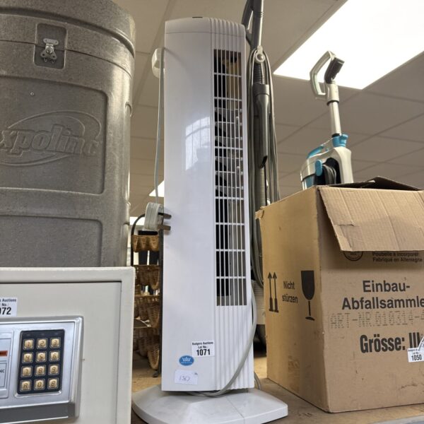 Vintage Prem-I-air tower fan for cooling and display.