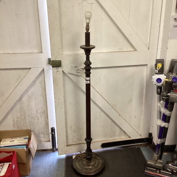 Vintage wooden standard lamp with a dark finish.
