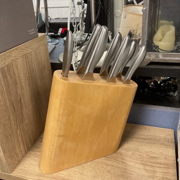 Stainless steel kitchen knife set in wooden block.