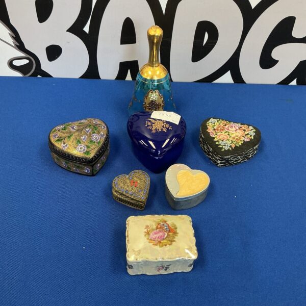Vintage trinket boxes with glass dome display, collectible miniature boxes.