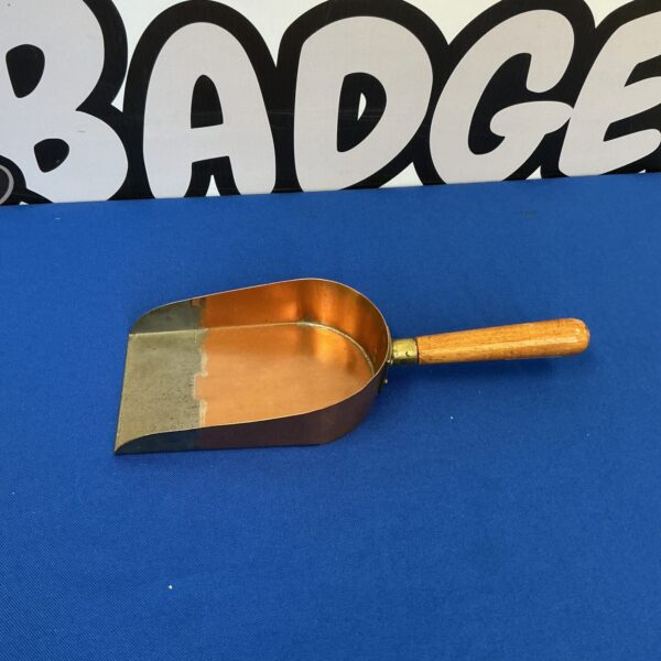Antique Victorian brass coal shovel with wooden handle.