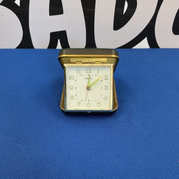 Vintage Seiko travel clock with analog display.