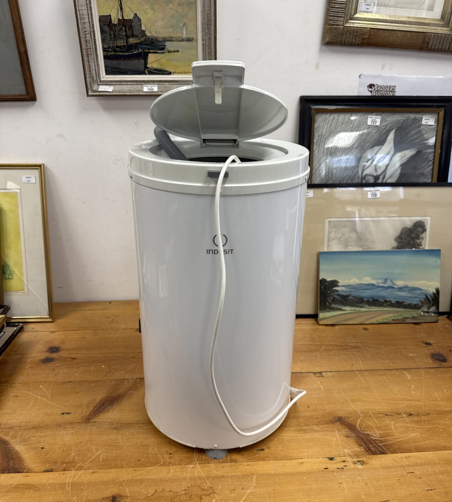 White Indesit autopump countertop tumble dryer, vintage laundry appliance.