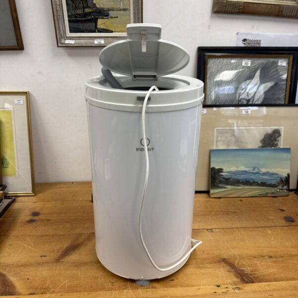 White Indesit autopump countertop tumble dryer, vintage laundry appliance.