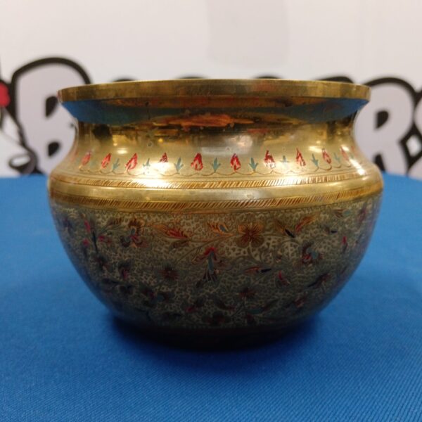 Intricate enamel floral pattern on vintage Indian brass bowl.