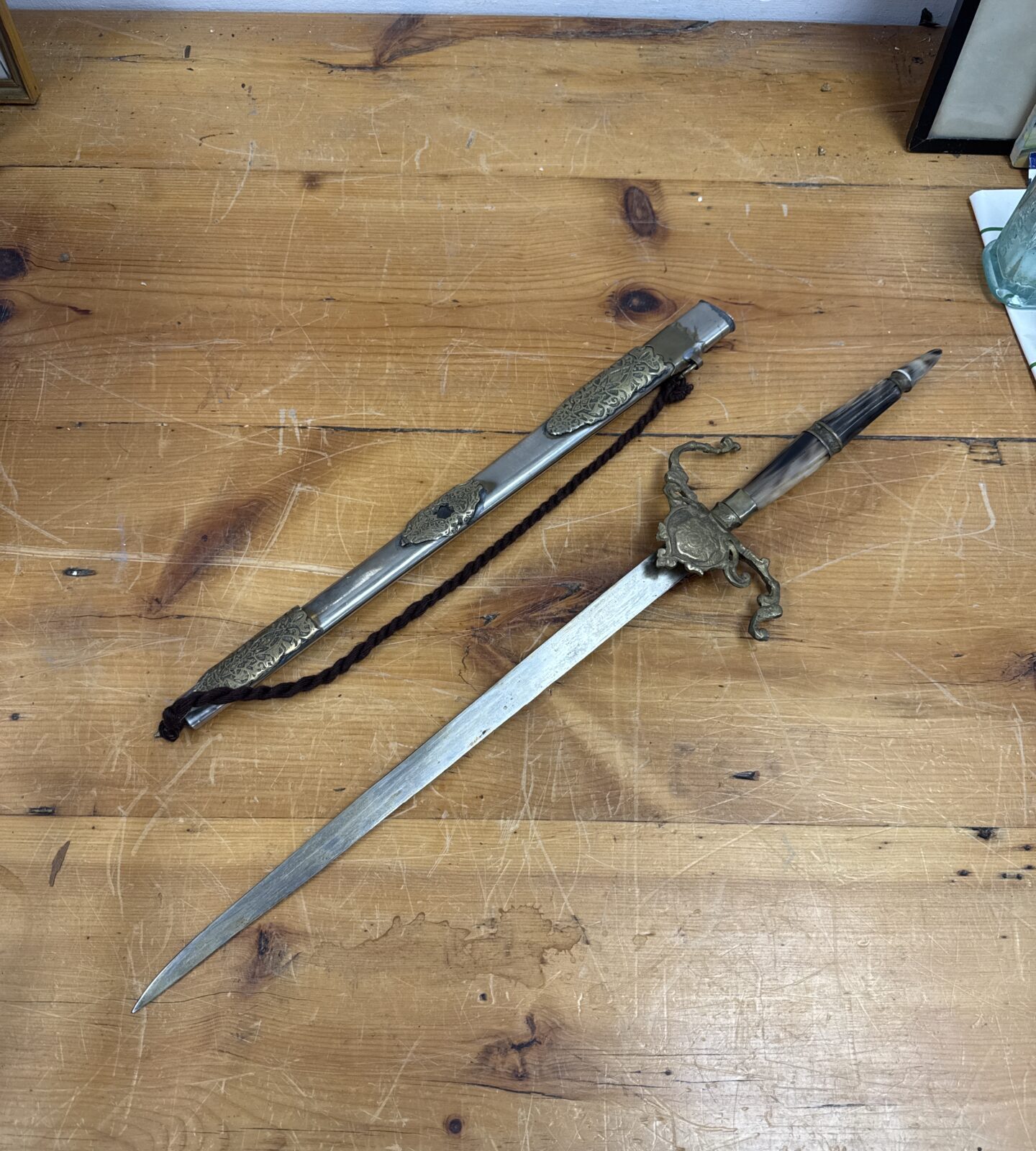 Vintage Indian ceremonial sword with detailed bone handle and scabbard.