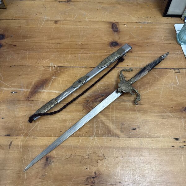 Vintage Indian ceremonial sword with detailed bone handle and scabbard.