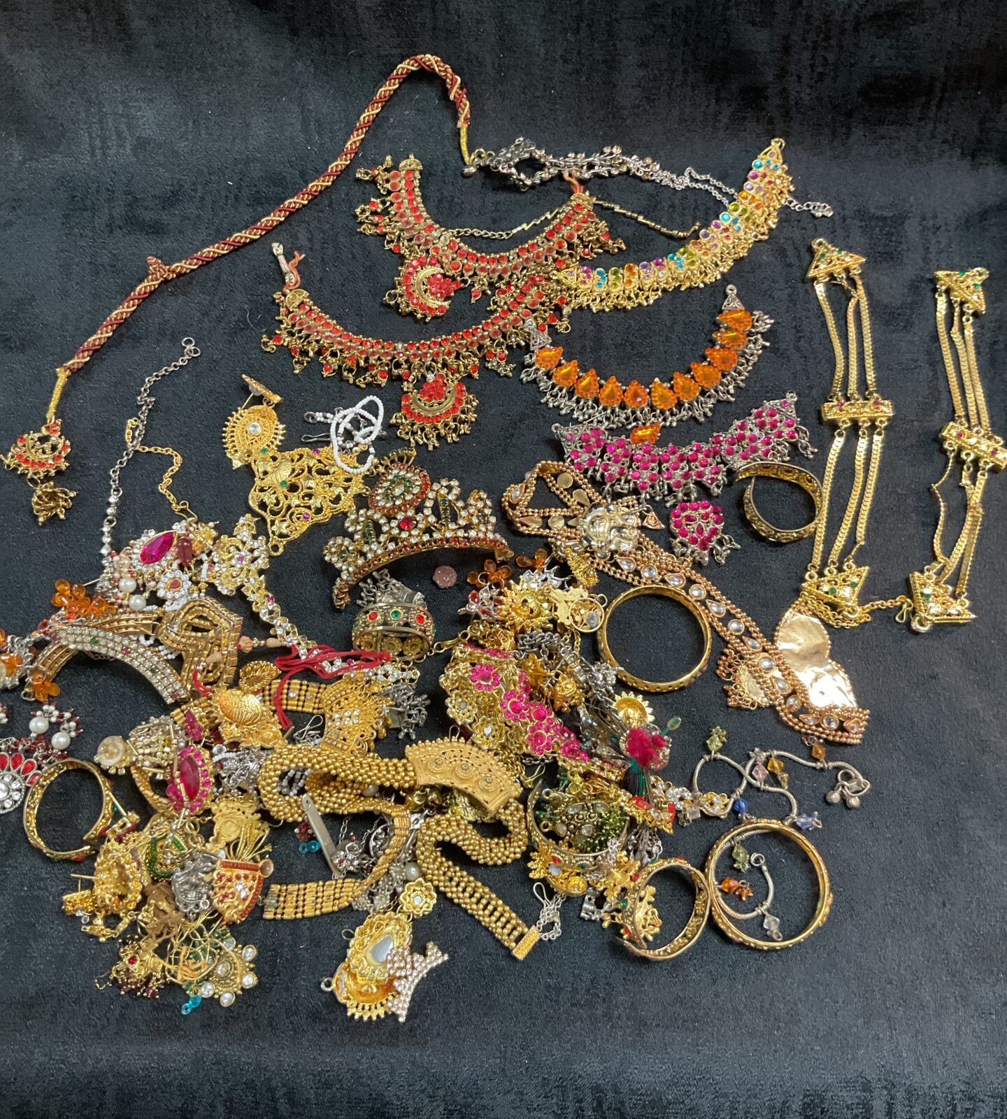 Vibrant mixed lot of Indian jewellery with colourful glass stones.