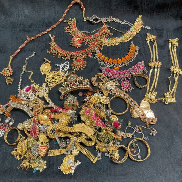 Vibrant mixed lot of Indian jewellery with colourful glass stones.