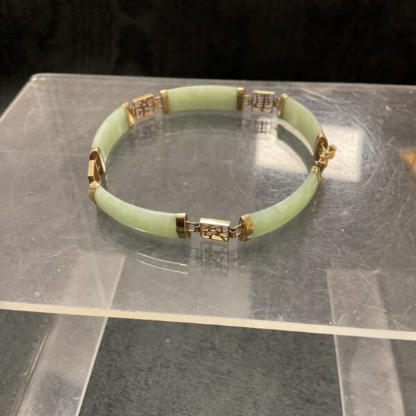 Vintage 9 carat gold and jade link bracelet with Chinese symbols.