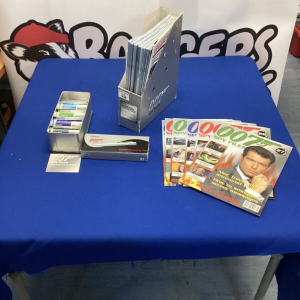 James Bond memorabilia bundle with spy pen and playing cards.