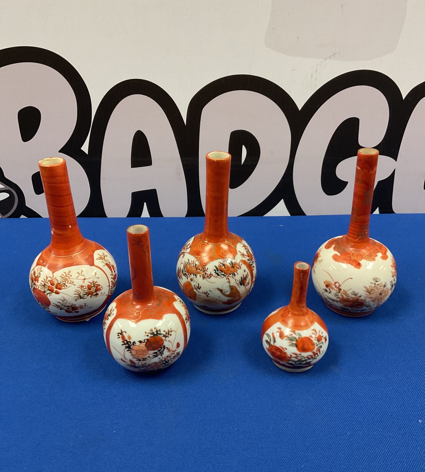 Group of five miniature Japanese Kutani vases with floral designs.