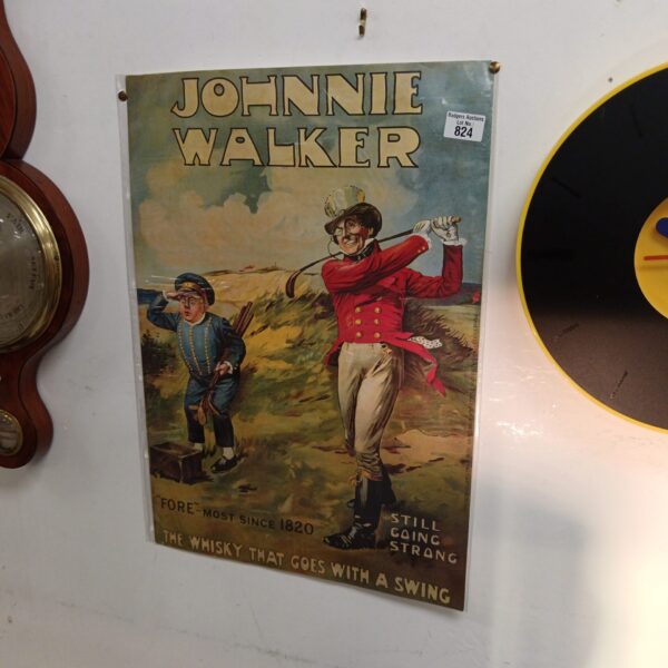 Vintage Johnnie Walker golf poster featuring a golfer in action.