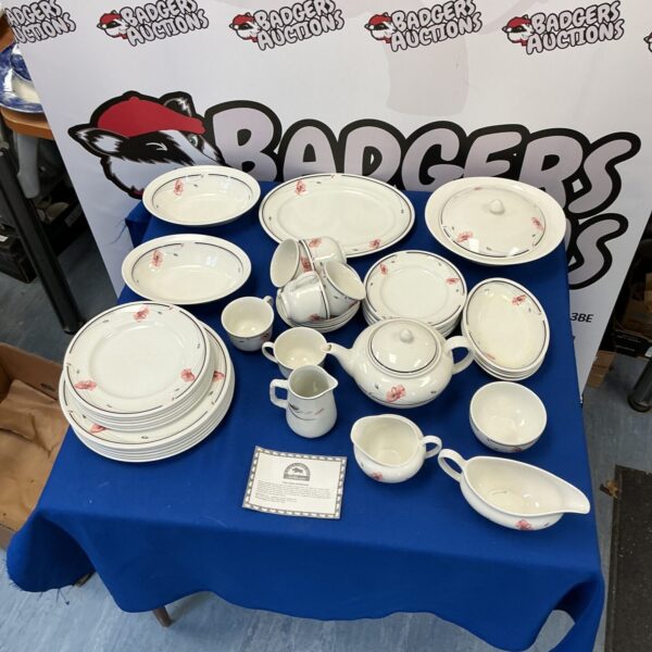 Vintage Johnson Bros floral dinner service set on a table.