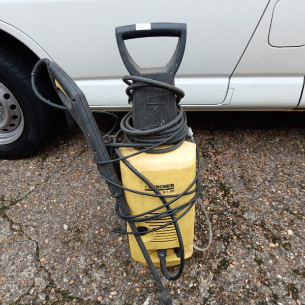Yellow and black Karcher K3.99 pressure washer for cleaning.
