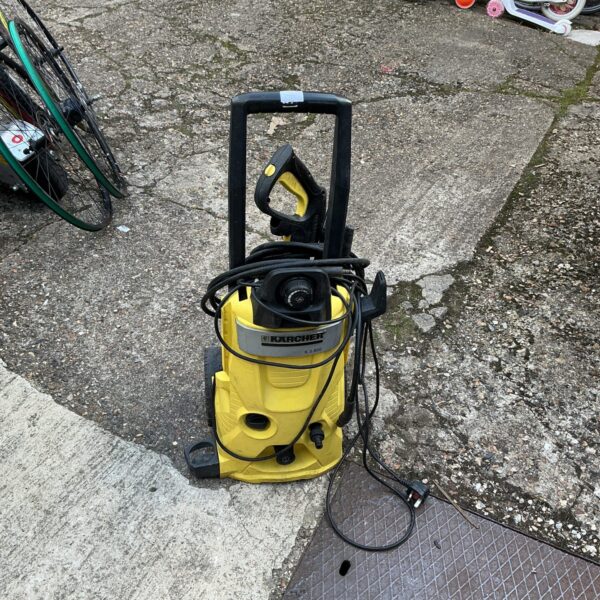 Front view of a yellow Karcher power washer for garden cleaning.