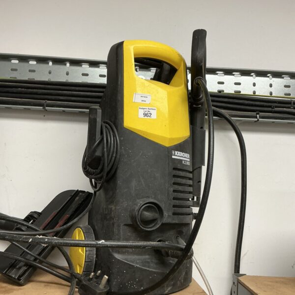 Front view of a used Karcher power washer for garden cleaning.