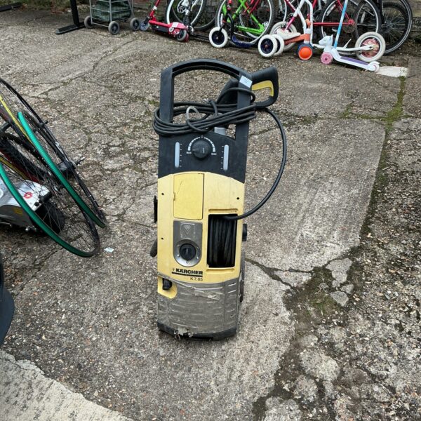 Front view of a Karcher power washer in used condition.