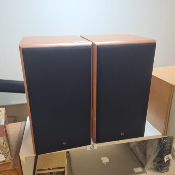 Vintage KEF Cresta SP3303 bookshelf speakers in wooden cabinets.