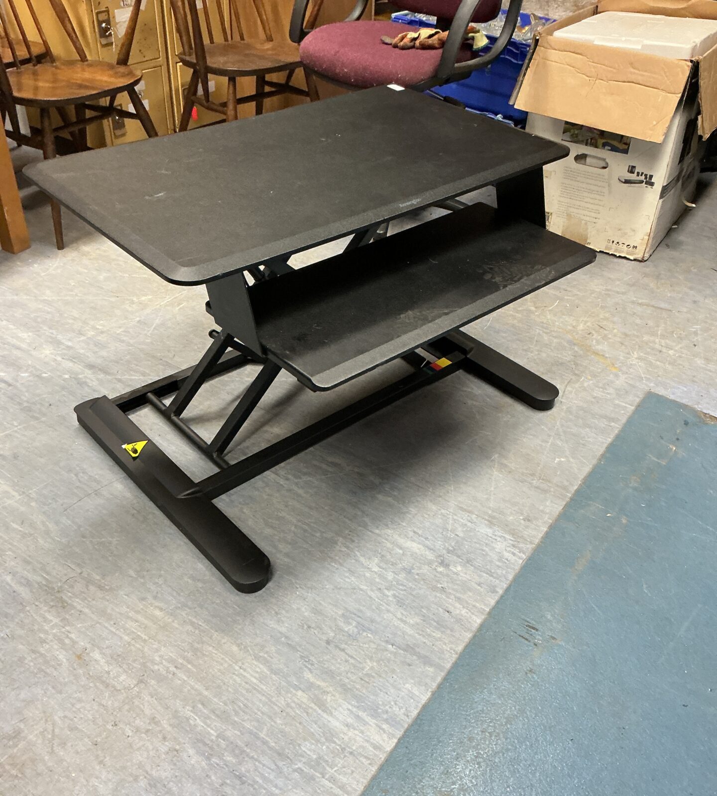 Black Kensington desk converter for adjustable standing workstation.