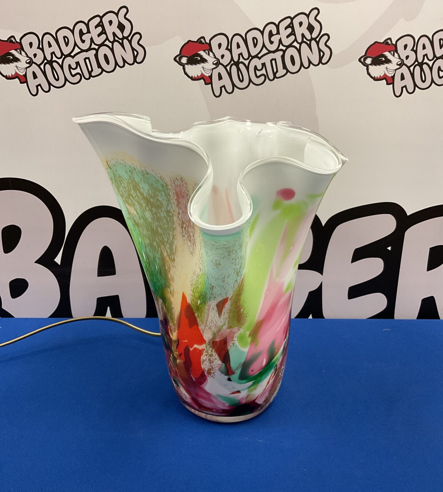 Vibrant Krosno handkerchief vase with colourful glass swirls.