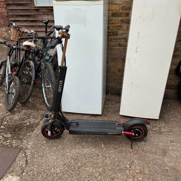 Side view of a foldable Kugoo electric scooter.