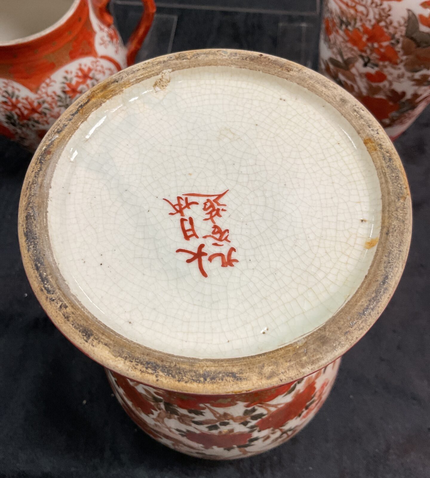 Japanese Kutani porcelain base with red character markings.