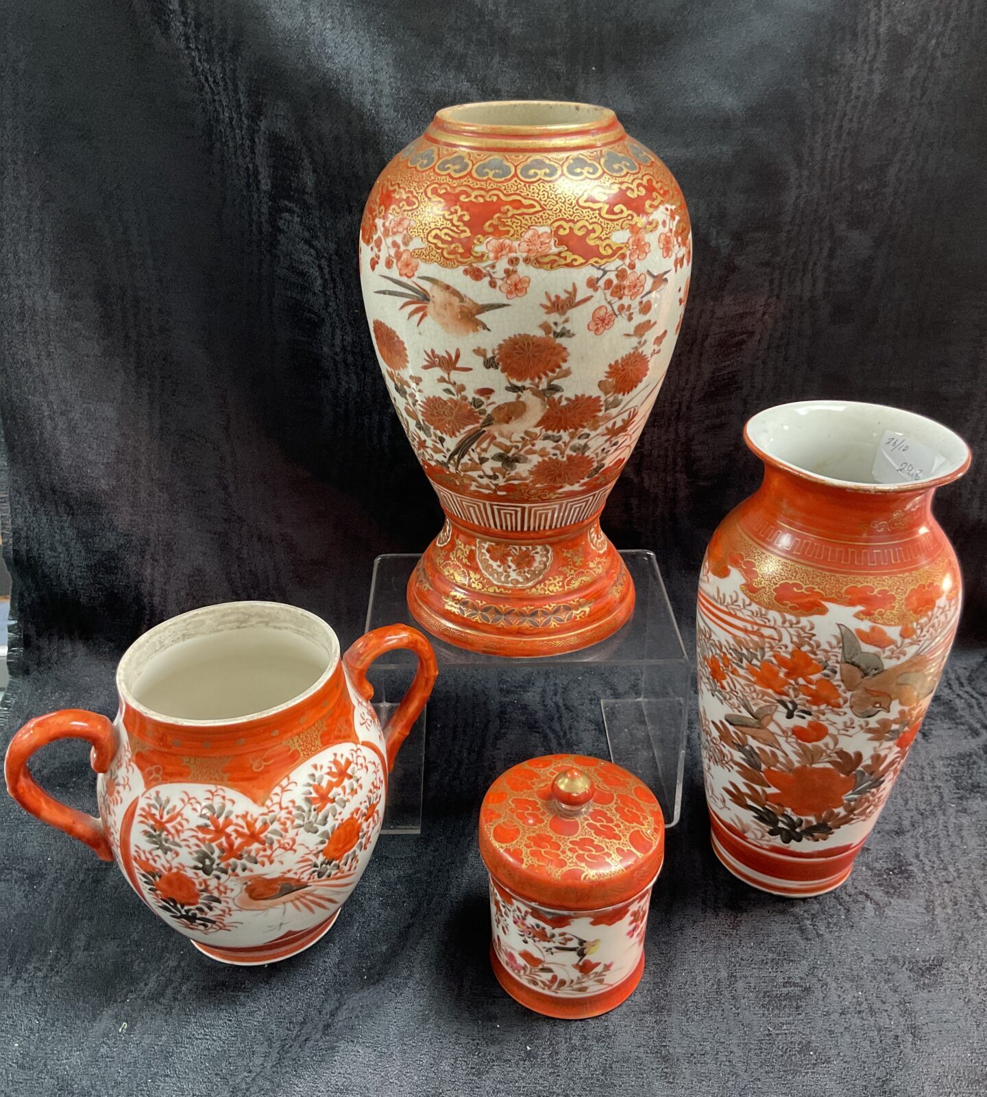 Antique Japanese Kutani porcelain collection featuring vases and pot.