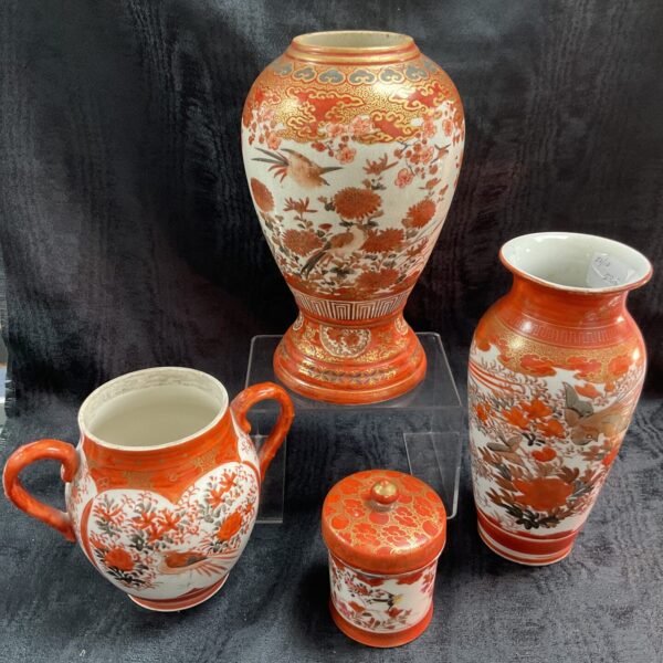 Antique Japanese Kutani porcelain collection featuring vases and pot.