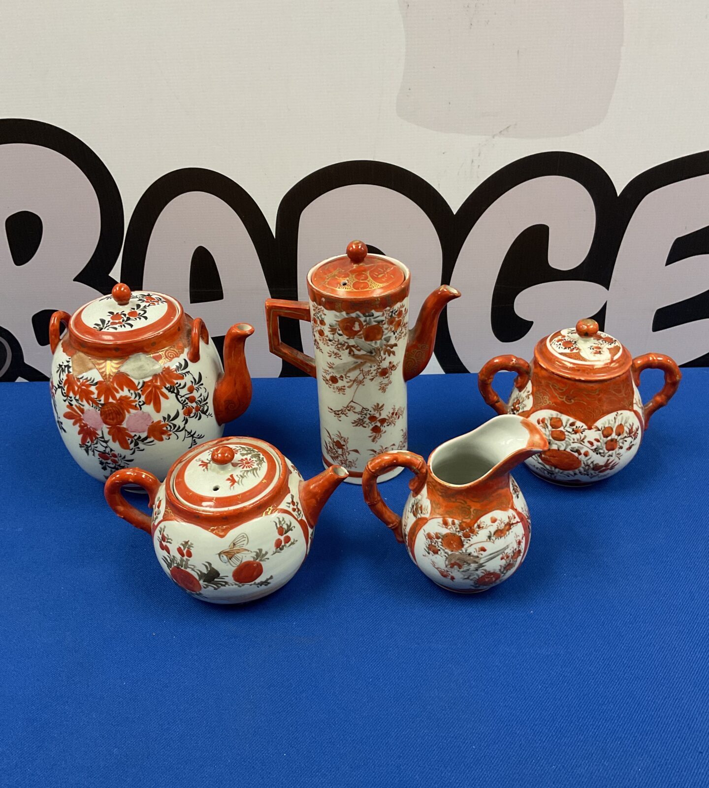 Vintage Kutani porcelain teapot set with floral designs.