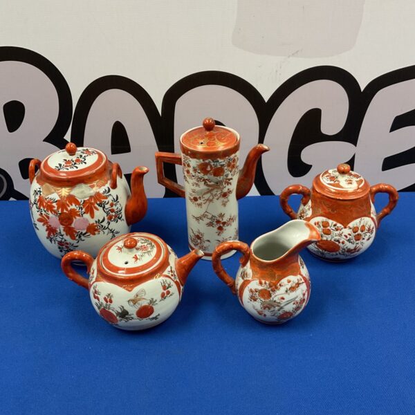 Vintage Kutani porcelain teapot set with floral designs.