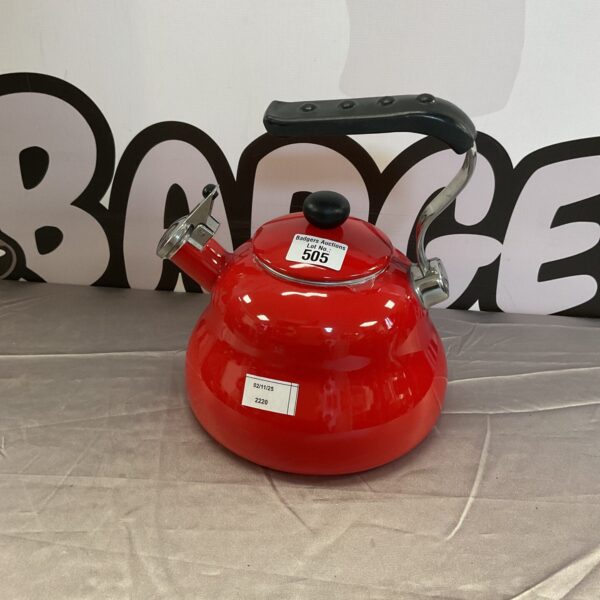 Vintage red La Cafetire enamel stovetop kettle for tea.