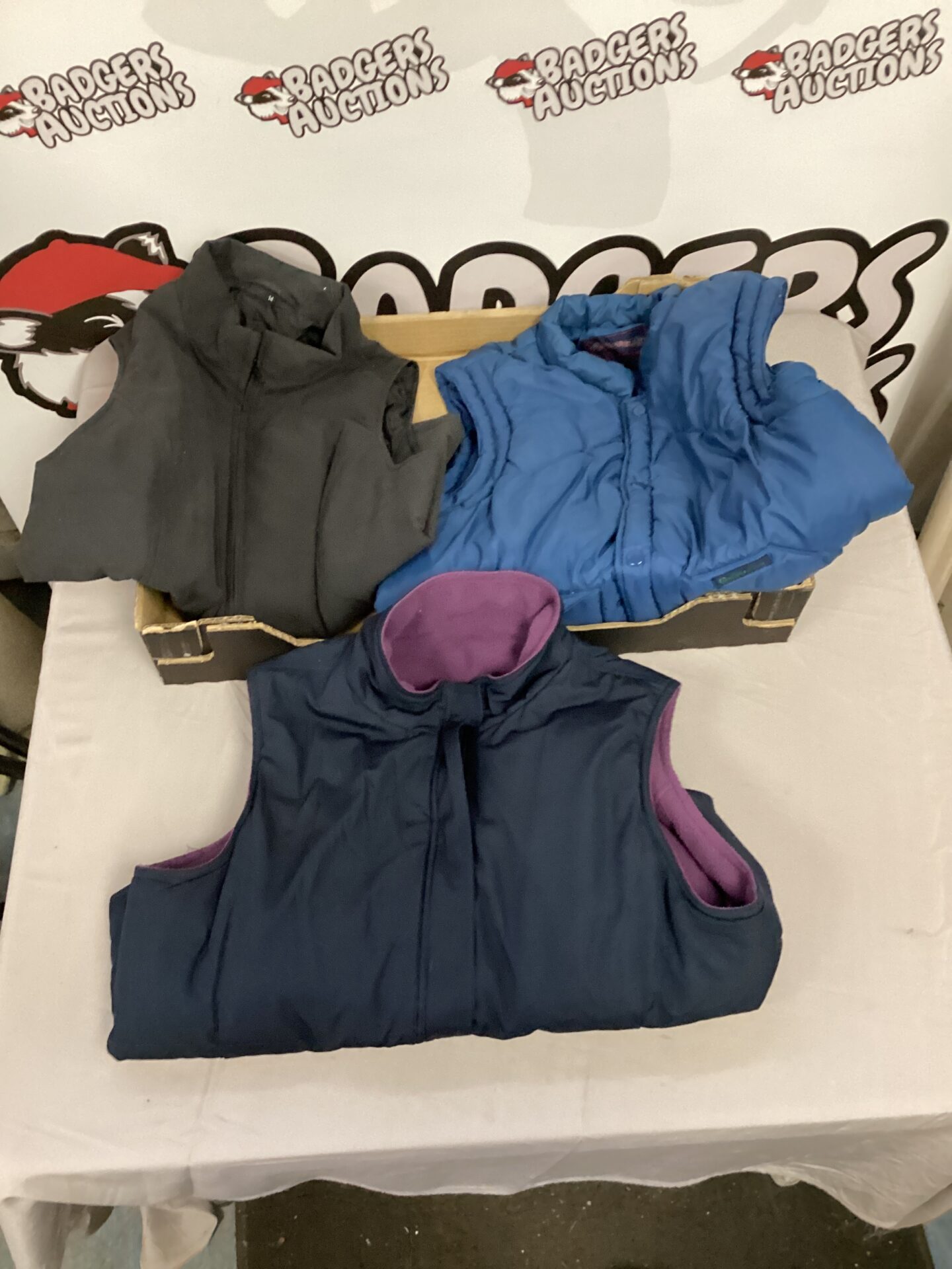 Three ladies gilets in a lot, size 14, reversible design.