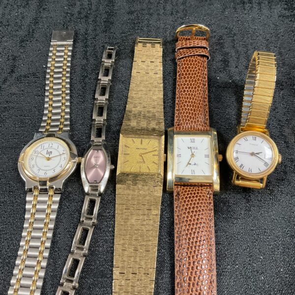 Ladies wristwatches lot featuring gold tone and stainless steel designs.