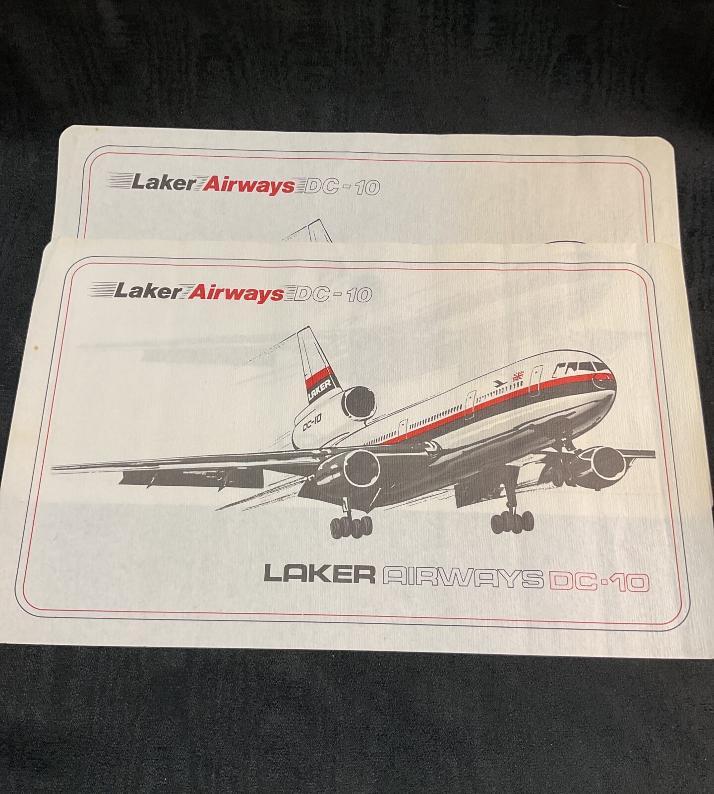 Vintage Laker Airways DC10 tray covers, aviation collectible.