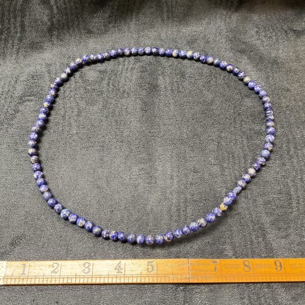 Close-up of a beautiful lapis lazuli beaded necklace.