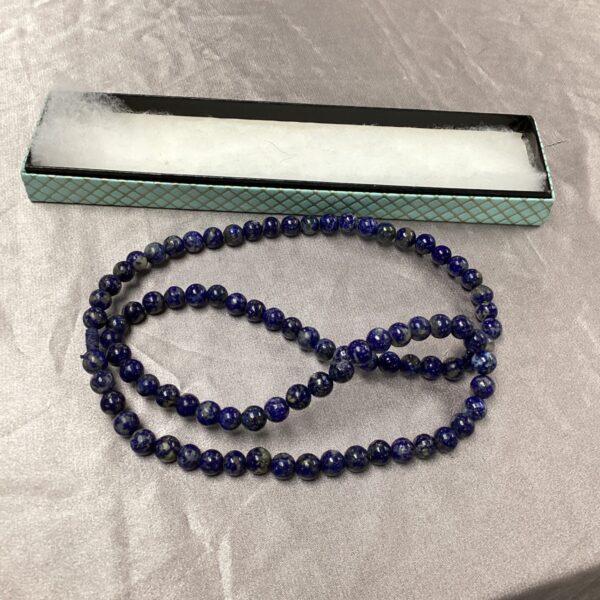 Vibrant blue lapis lazuli necklace with polished gemstone beads.