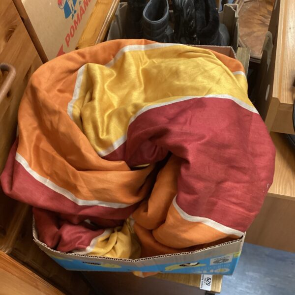 Vibrant orange bed throw blanket for home decor.