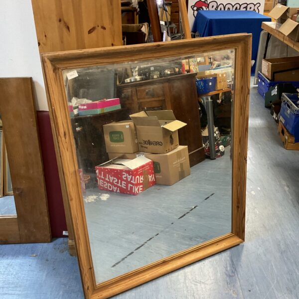Large pine framed mirror with a rustic vintage style.