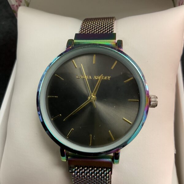 Front view of a Laura Ashley iridescent mesh strap wristwatch.