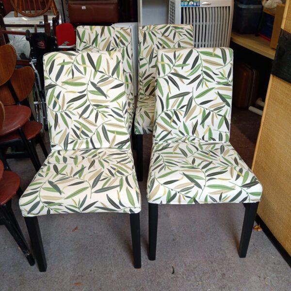 Set of four leaf pattern dining chairs for kitchen or dining room.