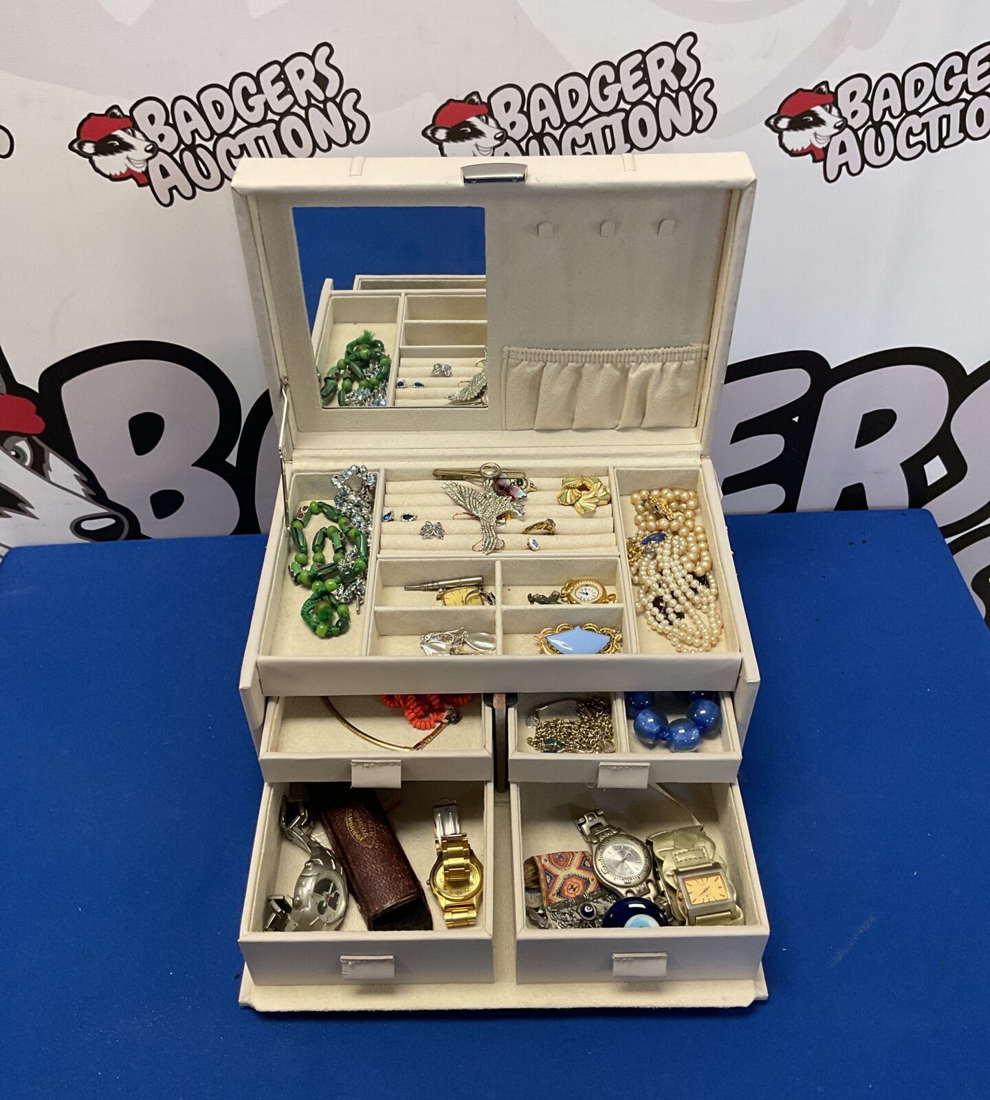 Vintage leather jewellery box filled with silver and assorted jewellery.