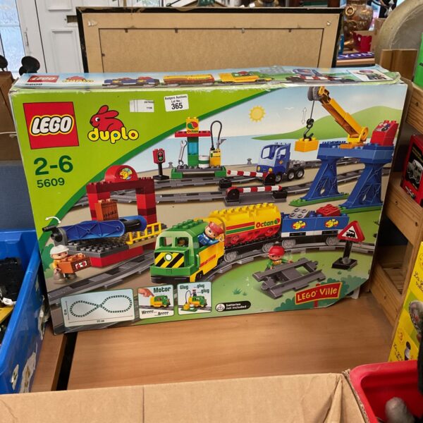 Colourful Lego Duplo train set 5609 with railway and figures.