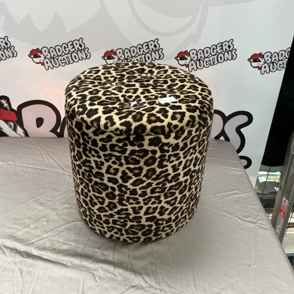 Front view of a leopard print storage ottoman.