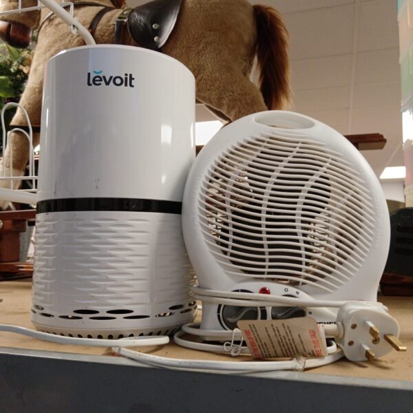 White Leviot dehumidifier and small electric heater appliance.