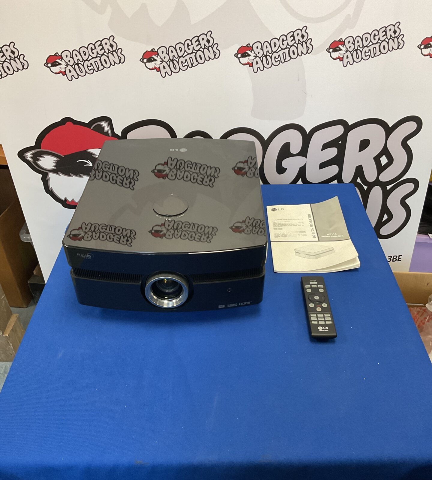 LG AF115 LCOS projector with remote for home theater.