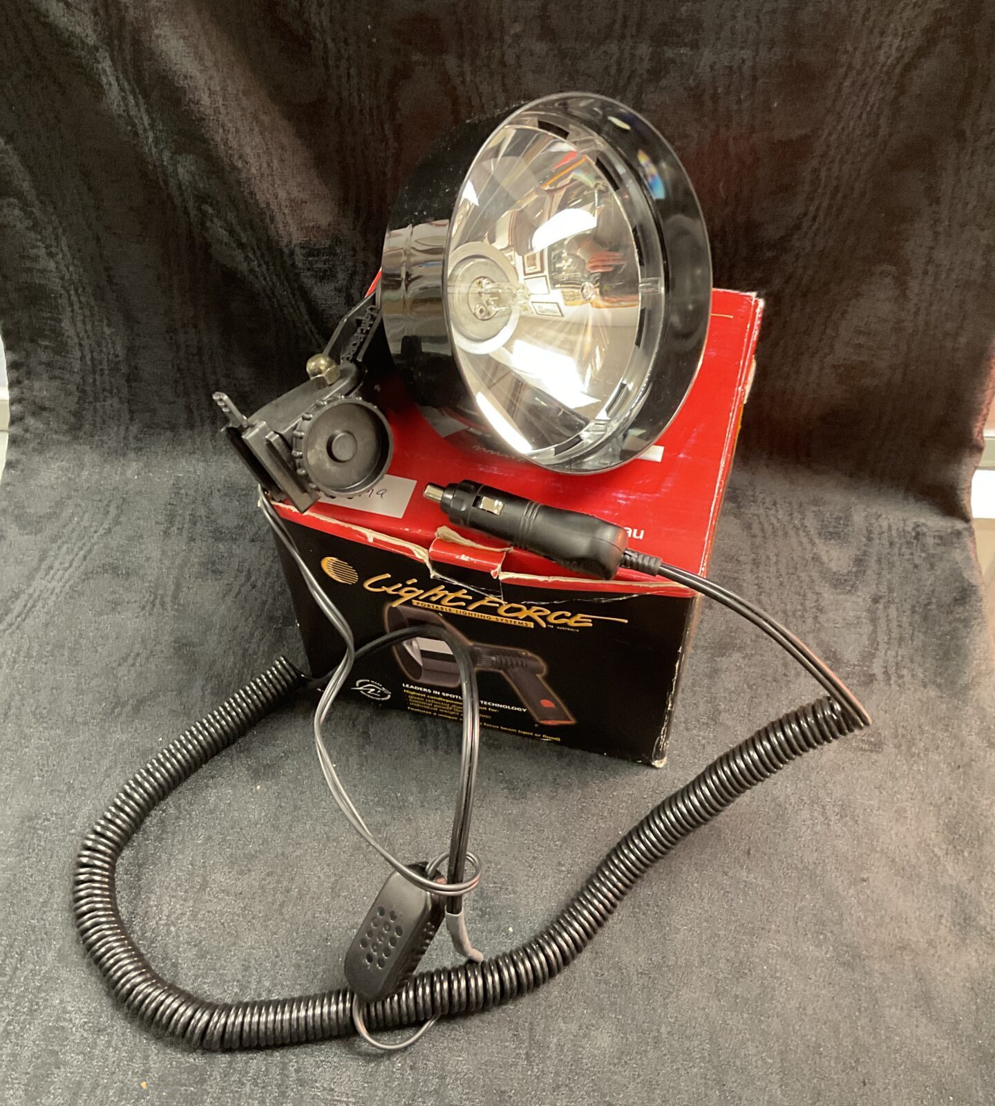 New Lightforce 12v spot lamp in original box, ideal for off-road vehicles.